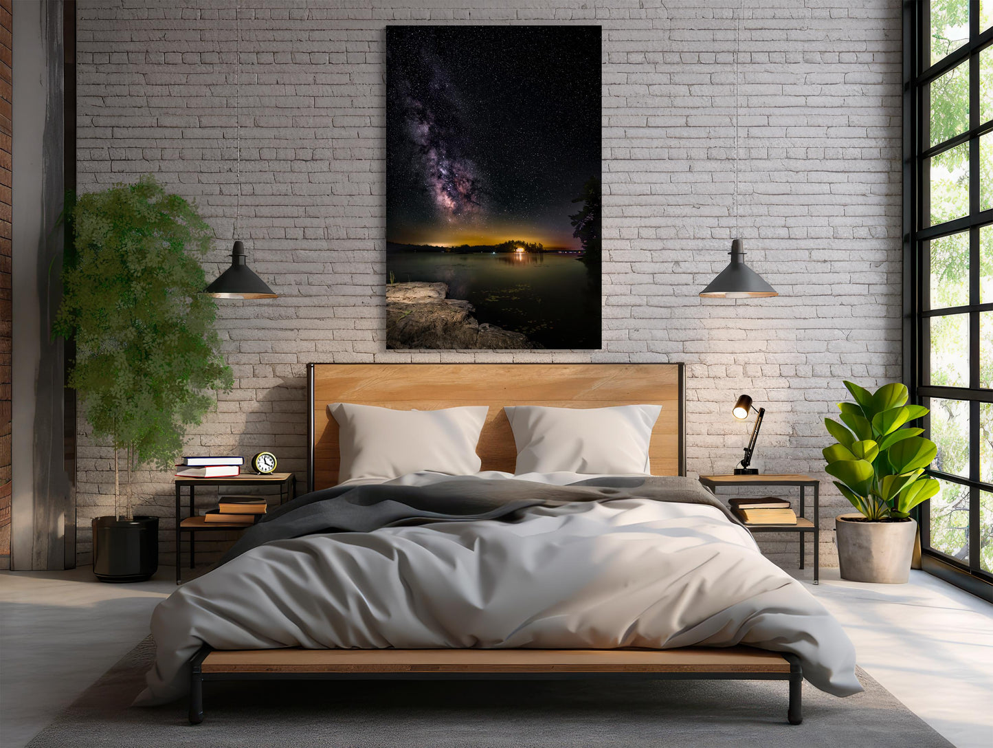 A vertical photograph of the Milky Way core arcs high above a calm, dark lake. A flat rock extends into the water, serving as the photographer’s platform. Countless stars and cosmic dust form a glowing band of light, reflecting faintly on the water’s surface under the deep black sky.