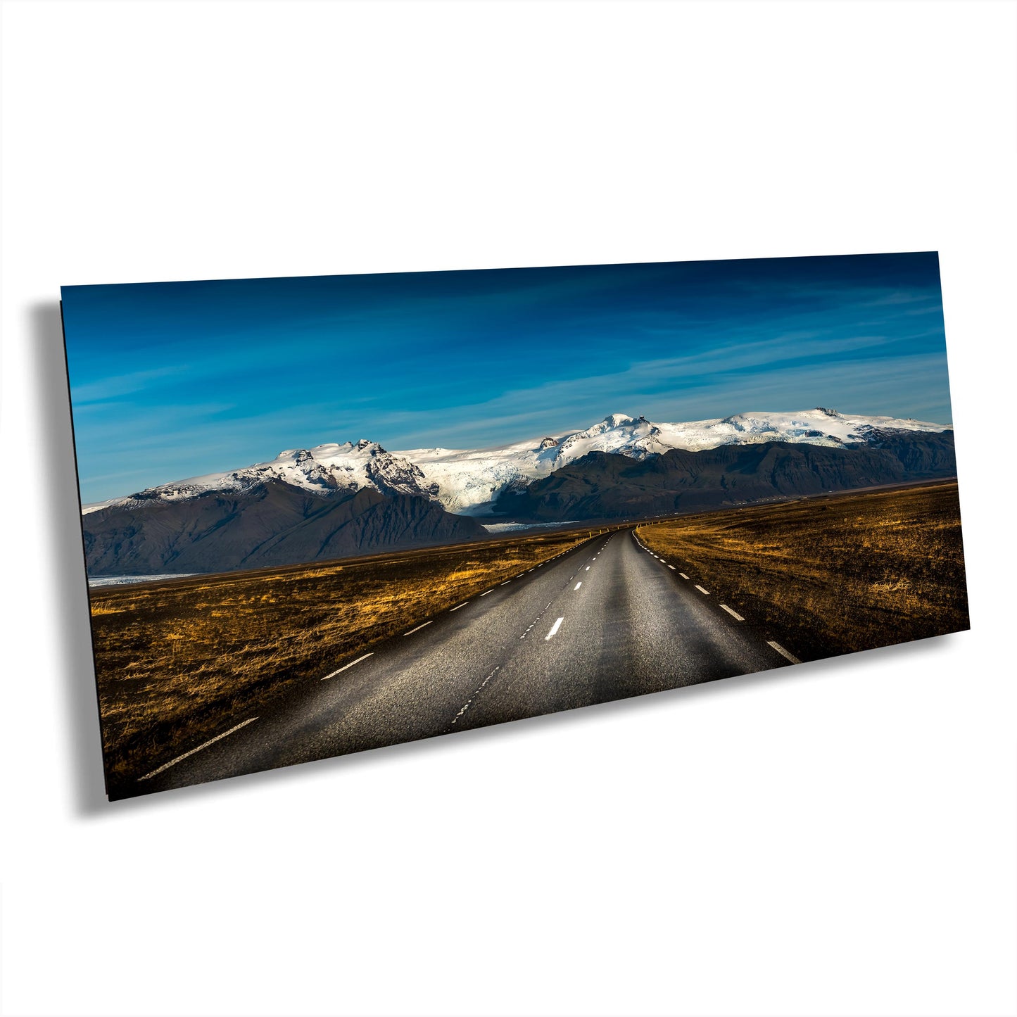 Iceland landscape photo, nature print, vast plains photo, volcanic mountains art, black soil contrast, golden grass print, Iceland wall decor, snow-capped peaks, black rock photography, Iceland scenery print, nature landscape art, calm and peaceful.