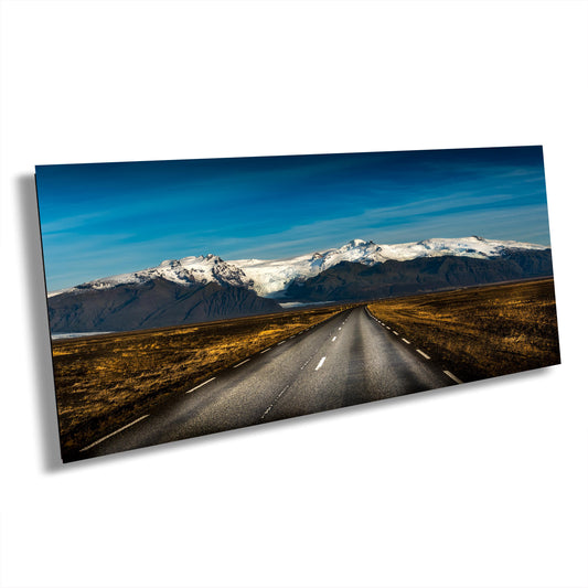 Iceland landscape photo, nature print, vast plains photo, volcanic mountains art, black soil contrast, golden grass print, Iceland wall decor, snow-capped peaks, black rock photography, Iceland scenery print, nature landscape art, calm and peaceful.